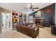 Relaxing living room showcases a brick fireplace and built-in bookshelves at 1222 Rainbrook Cir, Valrico, FL 33596