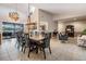Open concept living area leading to a dining area and screened-in patio with a lake view at 1222 Rainbrook Cir, Valrico, FL 33596