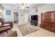 This open living room features neutral walls, tile floors, and comfortable seating at 1222 Rainbrook Cir, Valrico, FL 33596