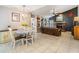 Open living area features a brick fireplace, built-in bookshelves, and tile floors at 1222 Rainbrook Cir, Valrico, FL 33596