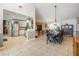 Open floor plan features kitchen, dining and living spaces with bright tile flooring at 1222 Rainbrook Cir, Valrico, FL 33596