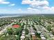 Vast aerial view of a residential area, highlighting the neighborhood's expansive tree canopy and proximity to amenities at 12316 Eldon Dr, Largo, FL 33774