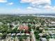 Expansive aerial view of a residential community with lush greenery, showcasing the property's desirable location near the water at 12316 Eldon Dr, Largo, FL 33774