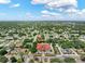 An aerial view highlighting this property's proximity to a well-maintained commercial building, community, and surrounding neighborhood at 12316 Eldon Dr, Largo, FL 33774