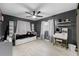 The bedroom has hardwood floors, a ceiling fan, and a makeup vanity table at 12316 Eldon Dr, Largo, FL 33774