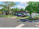 Lovely one-story home with a well-maintained lawn, two cars parked on the driveway, and a welcoming curb appeal at 12316 Eldon Dr, Largo, FL 33774