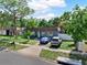 Charming one-story home features a well-manicured lawn and a neatly paved driveway accommodating two parked vehicles at 12316 Eldon Dr, Largo, FL 33774