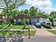 Charming one-story home features a well-manicured lawn and a neatly paved driveway accommodating two parked vehicles at 12316 Eldon Dr, Largo, FL 33774