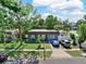 Charming one-story home features a well-manicured lawn and a neatly paved driveway accommodating two parked vehicles at 12316 Eldon Dr, Largo, FL 33774