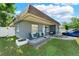 Charming home featuring a cozy front porch, landscaped yard, and a fresh, modern exterior at 12316 Eldon Dr, Largo, FL 33774