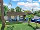 Charming single-story home with well-maintained lawn, blue front door, and inviting curb appeal at 12316 Eldon Dr, Largo, FL 33774