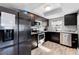 Modern kitchen design with stainless steel appliances, dark cabinets, and granite countertops at 12316 Eldon Dr, Largo, FL 33774