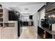 Bright kitchen featuring wood-style flooring, modern appliances and fixtures with a skylight at 12316 Eldon Dr, Largo, FL 33774