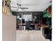 This home office features hardwood floors, custom desk, a ceiling fan, and ample lighting at 12316 Eldon Dr, Largo, FL 33774