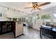 Inviting sun room with a bar, dining area, and plenty of natural light, perfect for entertaining at 12316 Eldon Dr, Largo, FL 33774
