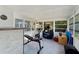 Spacious sun room with workout equipment and ample natural light, great for fitness or recreation at 12316 Eldon Dr, Largo, FL 33774