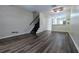 Spacious living room featuring wood floors and an open floor plan at 1247 Kennewick Ct, Wesley Chapel, FL 33543