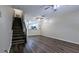 Inviting living area featuring hardwood floors and staircase to the second level at 1247 Kennewick Ct, Wesley Chapel, FL 33543