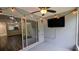 Outdoor patio space with hanging lights and a mounted TV, great for relaxing and entertaining outdoors at 1247 Kennewick Ct, Wesley Chapel, FL 33543