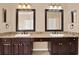 Elegant bathroom featuring granite countertops, dark wood cabinets, and framed mirrors at 13321 Lewis Raulerson Rd, Dover, FL 33527