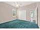Bedroom featuring a ceiling fan, a window, a closet and carpeted flooring at 13321 Lewis Raulerson Rd, Dover, FL 33527