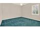 Neutral bedroom featuring a ceiling fan, a window, and carpeted flooring at 13321 Lewis Raulerson Rd, Dover, FL 33527