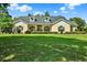 Beautiful single-Gathering home with a large front yard, manicured landscaping, and charming curb appeal at 13321 Lewis Raulerson Rd, Dover, FL 33527