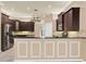 Gourmet kitchen boasts granite countertops, stainless steel appliances, and stylish tile backsplash at 13321 Lewis Raulerson Rd, Dover, FL 33527