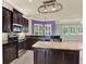 Kitchen featuring granite countertops, stainless steel appliances, and center island with seating at 13321 Lewis Raulerson Rd, Dover, FL 33527