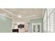 Open-concept living space connecting kitchen, dining, and living area with modern finishes at 13321 Lewis Raulerson Rd, Dover, FL 33527