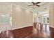 Spacious living room showcasing hardwood floors, neutral walls, and architectural details at 13321 Lewis Raulerson Rd, Dover, FL 33527