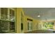 Covered outdoor patio with ceiling fans, windows, and glass doors for seamless indoor/outdoor living at 13321 Lewis Raulerson Rd, Dover, FL 33527