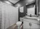 Modern bathroom featuring a shower/tub combo with decorative mountain artwork at 13735 Wineberry Dr, Dade City, FL 33525