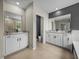 This bathroom features double sinks, granite counters and ceramic tile floors at 13735 Wineberry Dr, Dade City, FL 33525