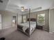 Large main bedroom with trey ceilings, carpet, windows and ensuite bath access at 13735 Wineberry Dr, Dade City, FL 33525