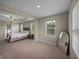 Primary bedroom view into ensuite bathroom and seating area at 13735 Wineberry Dr, Dade City, FL 33525