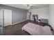 This bedroom has laminate flooring and a ceiling fan at 13735 Wineberry Dr, Dade City, FL 33525