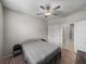 Neutral bedroom features a comfortable bed with standard closet space at 13735 Wineberry Dr, Dade City, FL 33525