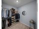 Walk-in closet featuring custom shelves and clothing racks at 13735 Wineberry Dr, Dade City, FL 33525