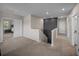 Upstairs hallway featuring neutral paint and carpet, leading to several bedroom entries at 13735 Wineberry Dr, Dade City, FL 33525