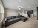 Comfortable upstairs living room featuring dark accent wall and plush seating at 13735 Wineberry Dr, Dade City, FL 33525