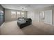 Upstairs living room featuring a plush sofa, neutral paint, and plenty of natural light at 13735 Wineberry Dr, Dade City, FL 33525