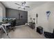 Office with ceiling fan and accent wall at 13735 Wineberry Dr, Dade City, FL 33525