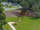 Community playground with swings, slides, and picnic area at 13735 Wineberry Dr, Dade City, FL 33525