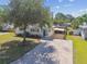 Charming single-story home with well-maintained landscaping and shade tree at 1529 Essex N Dr, St Petersburg, FL 33710