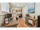 Cozy home office with a rustic wooden desk, natural light, and stylish decor at 1529 Essex N Dr, St Petersburg, FL 33710