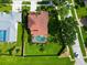 Aerial view of the house with a screened-in pool and spacious backyard at 1649 Ledgestone Dr, Brandon, FL 33511
