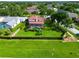 Expansive, fully fenced backyard featuring a screened-in pool area and mature trees at 1649 Ledgestone Dr, Brandon, FL 33511