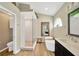 Beautiful bathroom showcasing a freestanding tub, frameless shower, natural elements, and a modern sink and vanity at 1649 Ledgestone Dr, Brandon, FL 33511