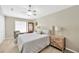 Comfortable bedroom with a plush bed, soft lighting, and a stylish armchair at 1649 Ledgestone Dr, Brandon, FL 33511